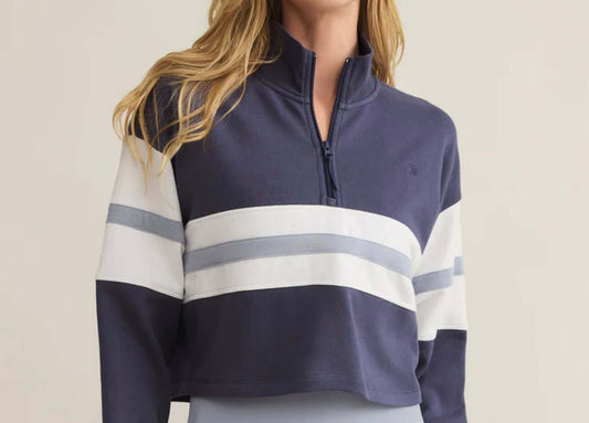 Model wearing Z Supply All Day Rugby Sweatshirt, a cozy half-zip with navy and white stripes in brushed fleece.