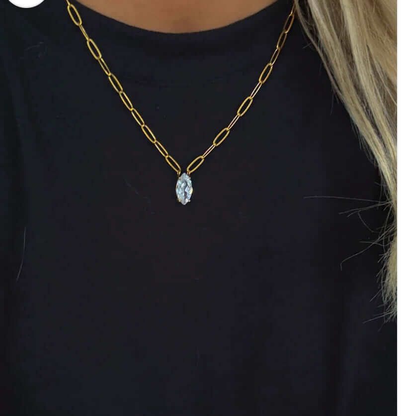Gold chain pendant necklace featuring a diamond accent, 16-18 inches long, water-resistant design and lifetime warranty.