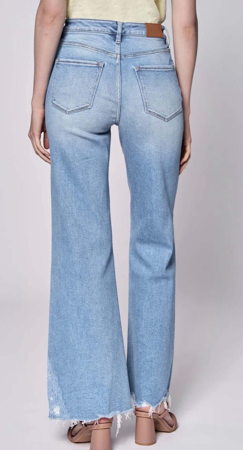 Back view of Fiona high rise full inseam jeans with fray hem, showcasing a stylish and comfortable fit.