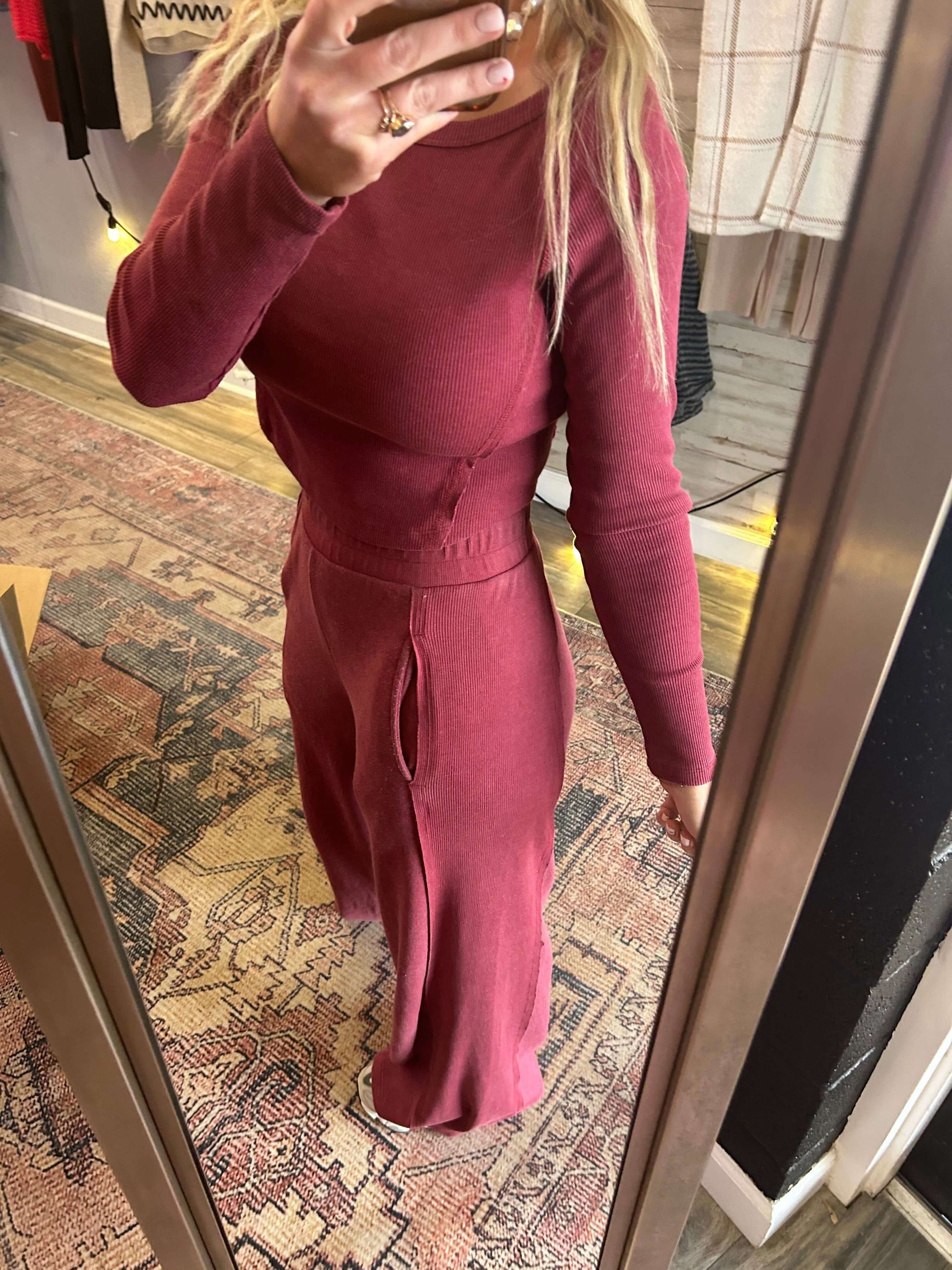 Model showcasing the Get It Girl 2pc Longsleeve Set in Berry, featuring a boatneck top and wide leg flares.