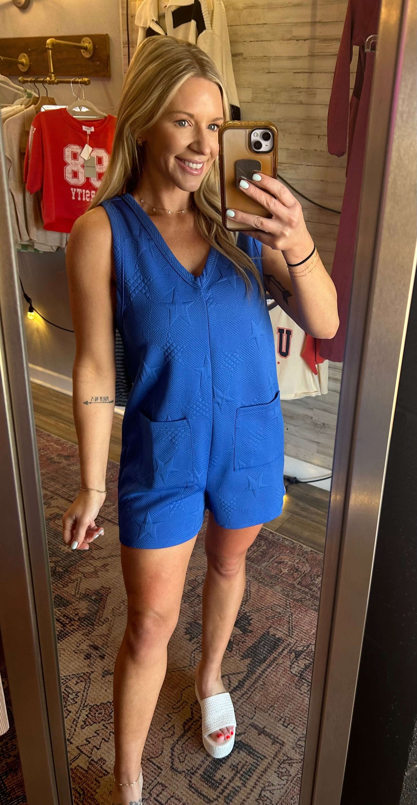 Model wearing a royal blue STAR V Neck romper, perfect for Spring Break and summer events, showcasing a textured design.