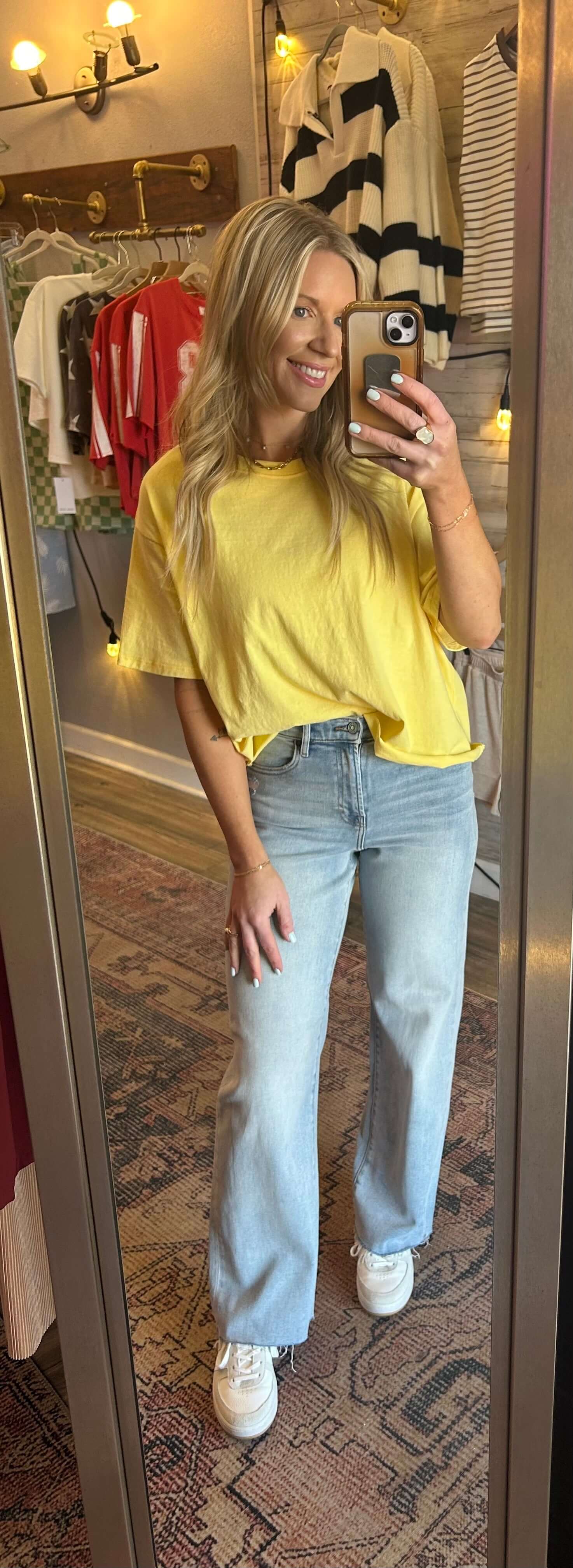 Model wearing HIDDEN Logan Highrise Dad Jeans in light wash paired with a yellow top, showcasing a trendy spring outfit.