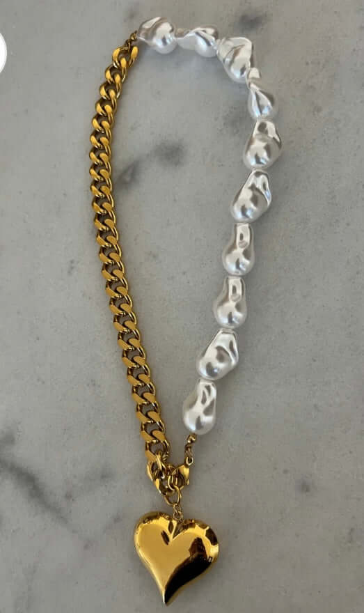 Charlotte Necklace: 17-inch water-resistant necklace with half water pearls, gold chain, and heart charm.