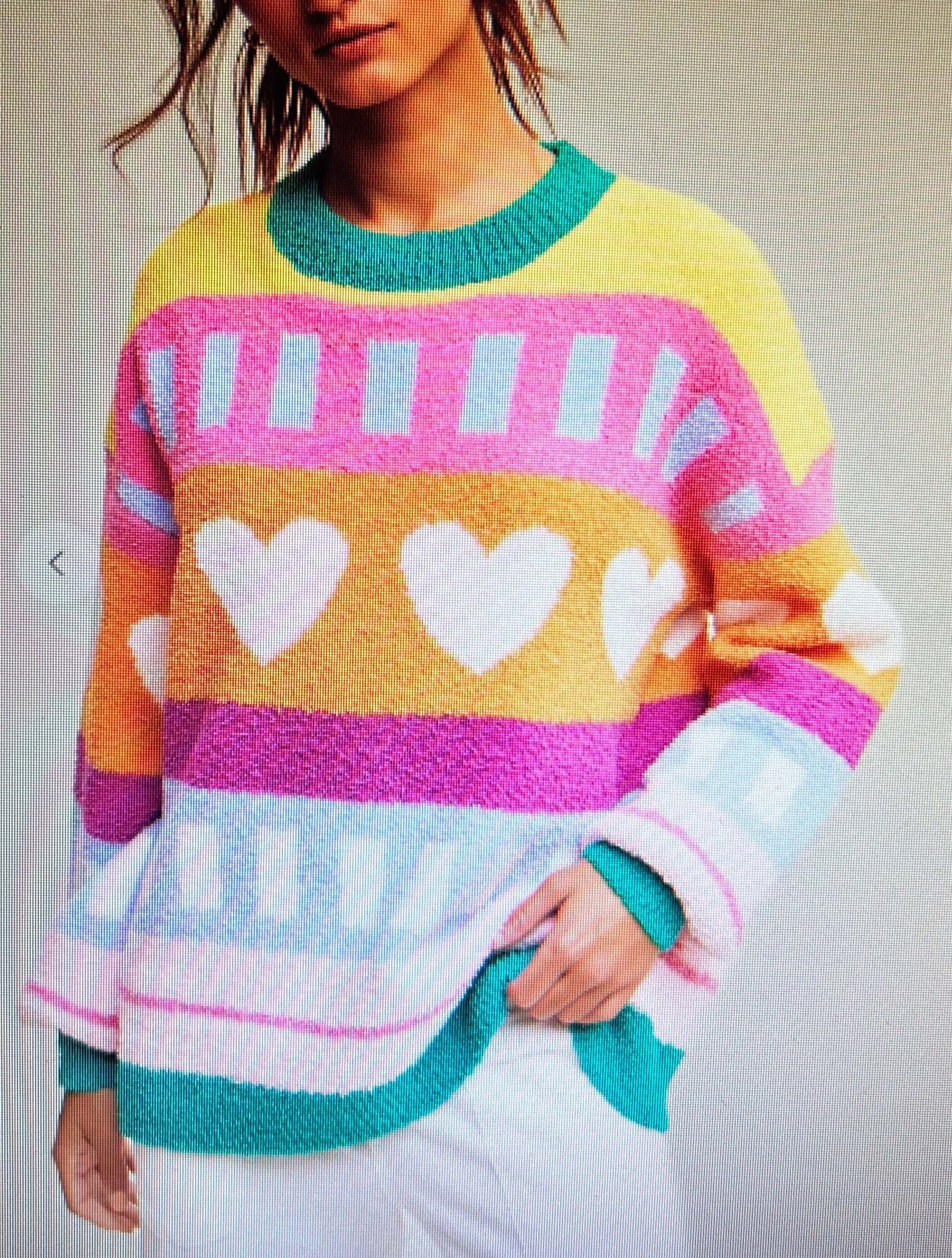 Patterned playful hearts soft knit sweater in vibrant colors, perfect for winter and Valentine's Day wear.