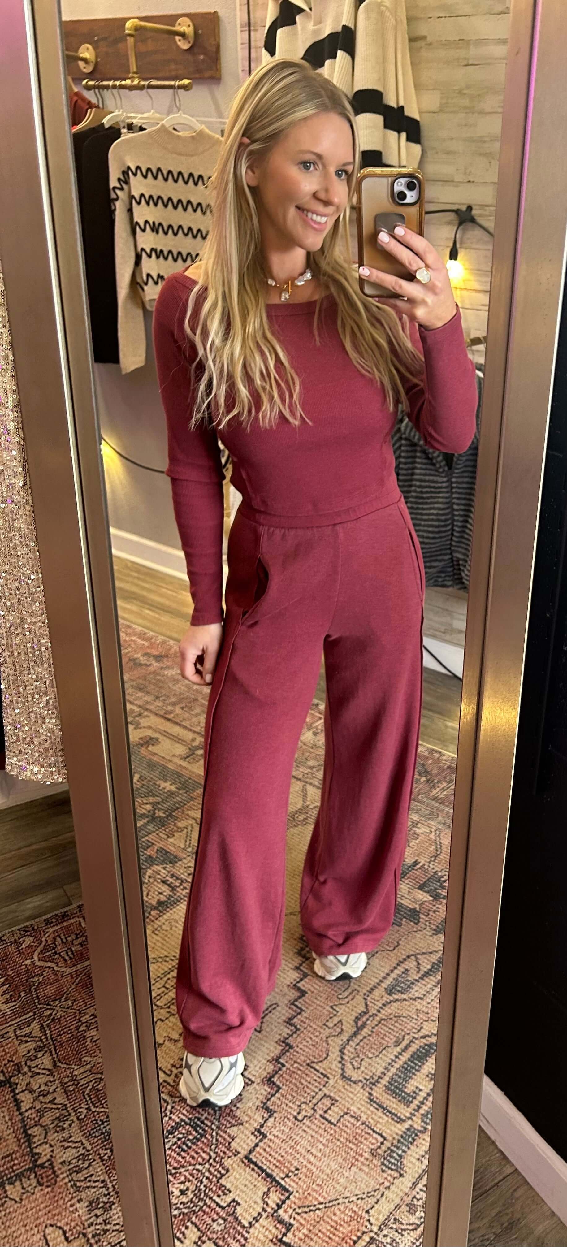 Model wearing Get It Girl 2pc Longsleeve Set in Berry featuring wide-leg flares and boatneck top.