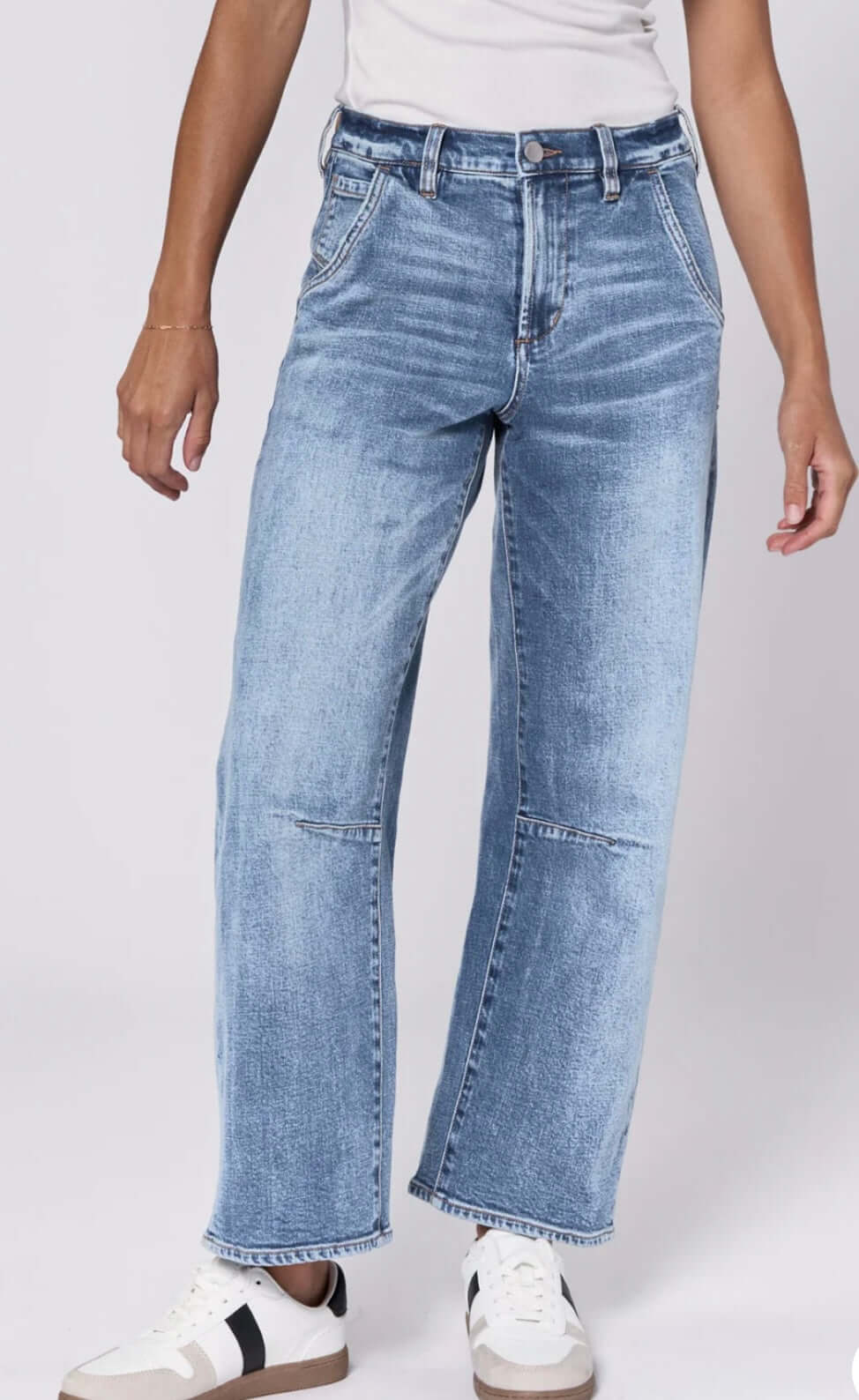 Highrise loose fit cropped barrel jeans in medium wash, featuring utility pockets and a relaxed silhouette.