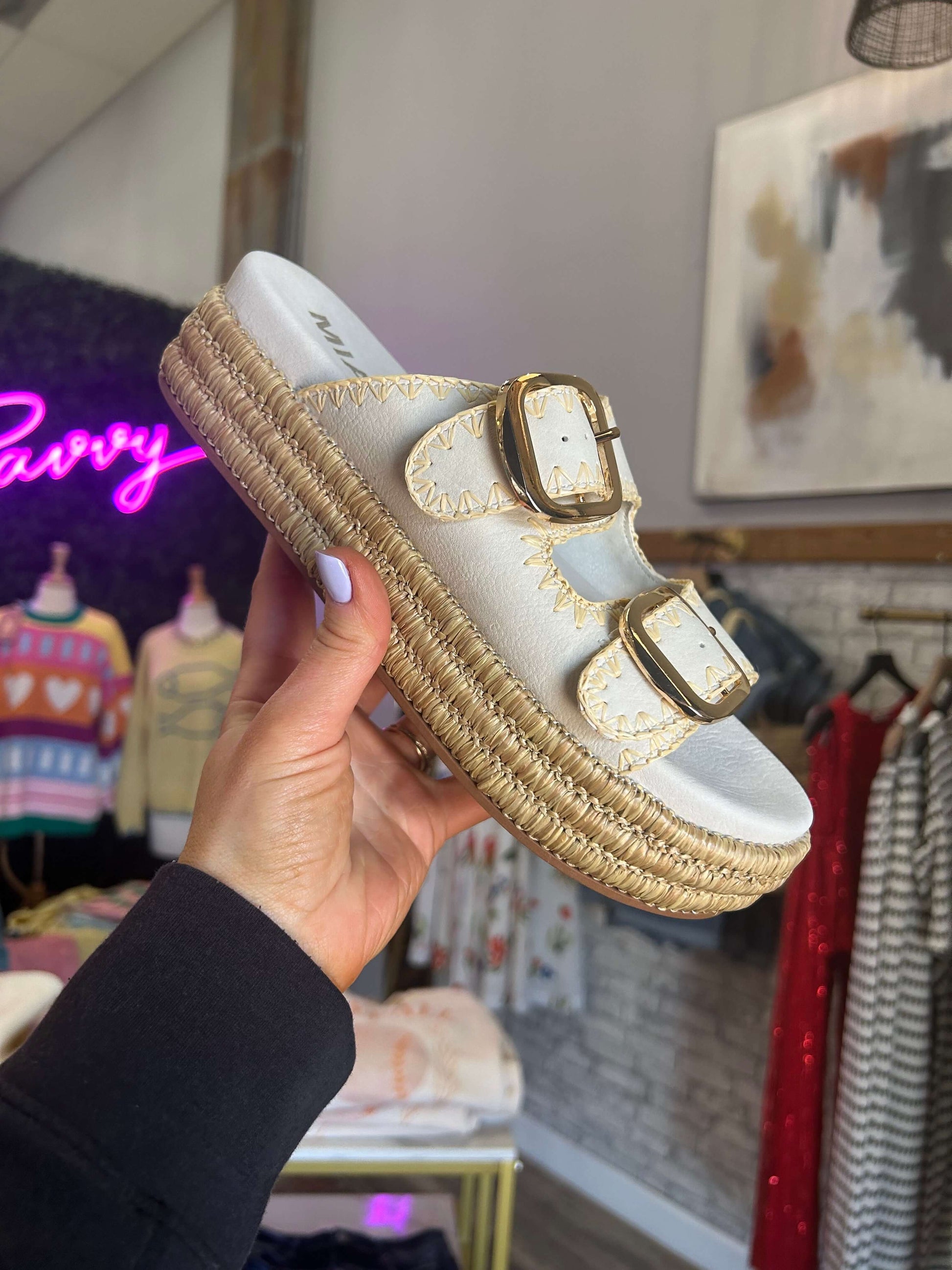 MiA Mieko sandals in seashell color with gold buckles and raffia-wrapped platform, perfect for vacation styling.