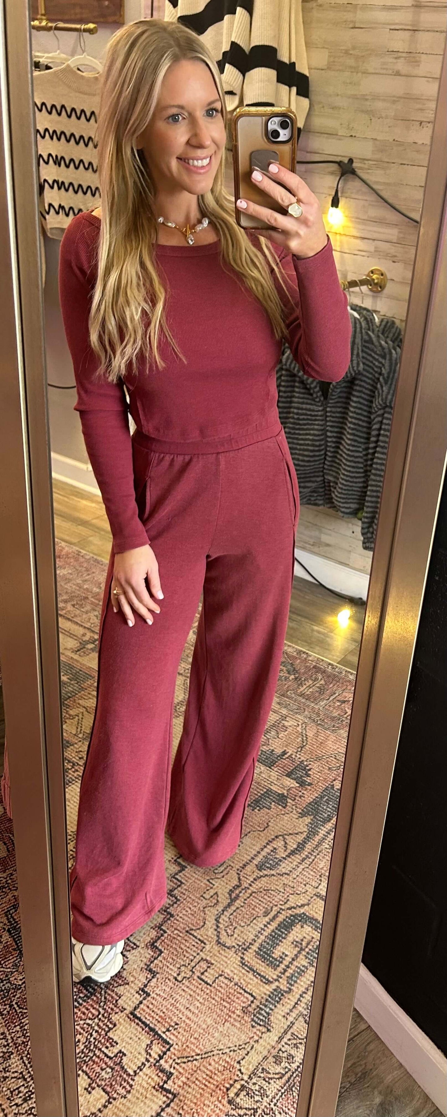 Woman wearing Get It Girl 2pc Longsleeve Set in Berry with wide leg flares and boatneck neckline.