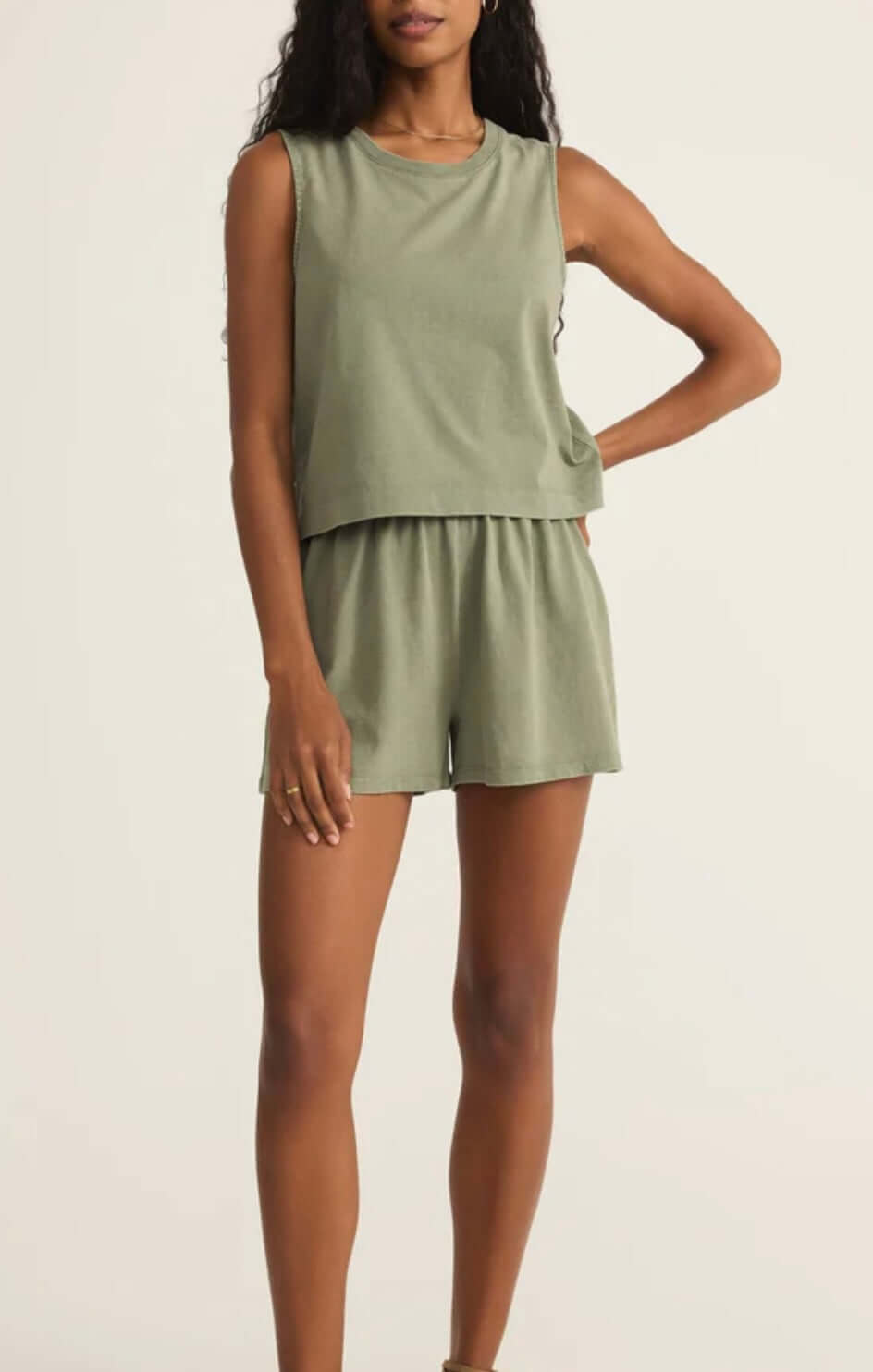 Model wearing Z Supply Avocado Sloan Tank and Scout Short set in olive green, showcasing a relaxed fit and sleeveless design.