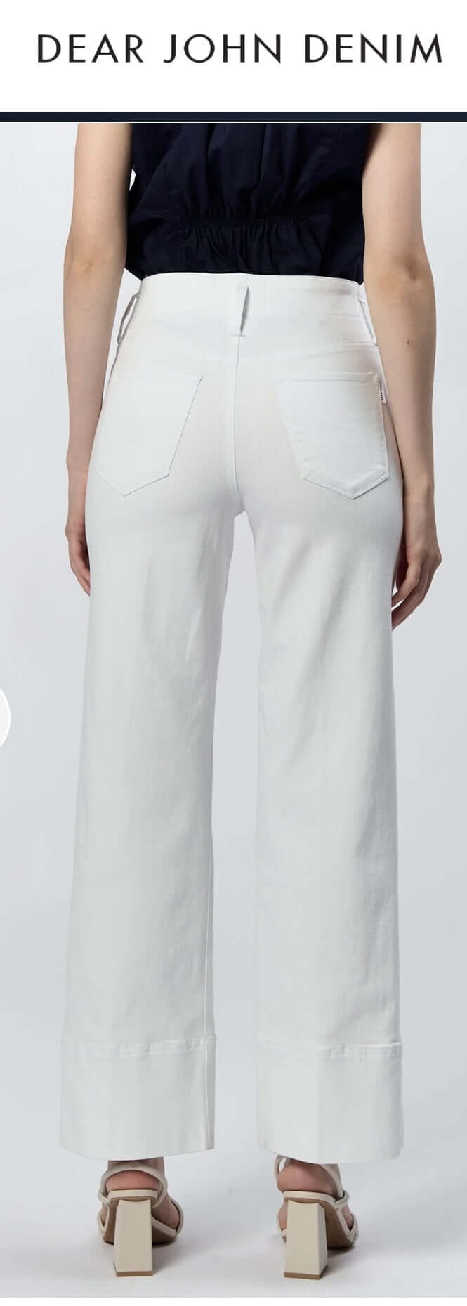 Back view of Dear John Holly highrise wide hem jeans in white, showcasing stylish design and flattering fit.