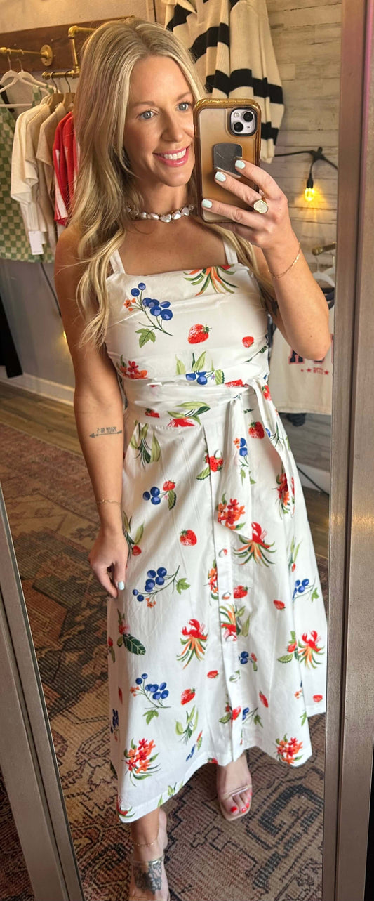 Model wearing a sweet summer 2pc skirt set with floral patterns, featuring adjustable straps and a zip-up back.