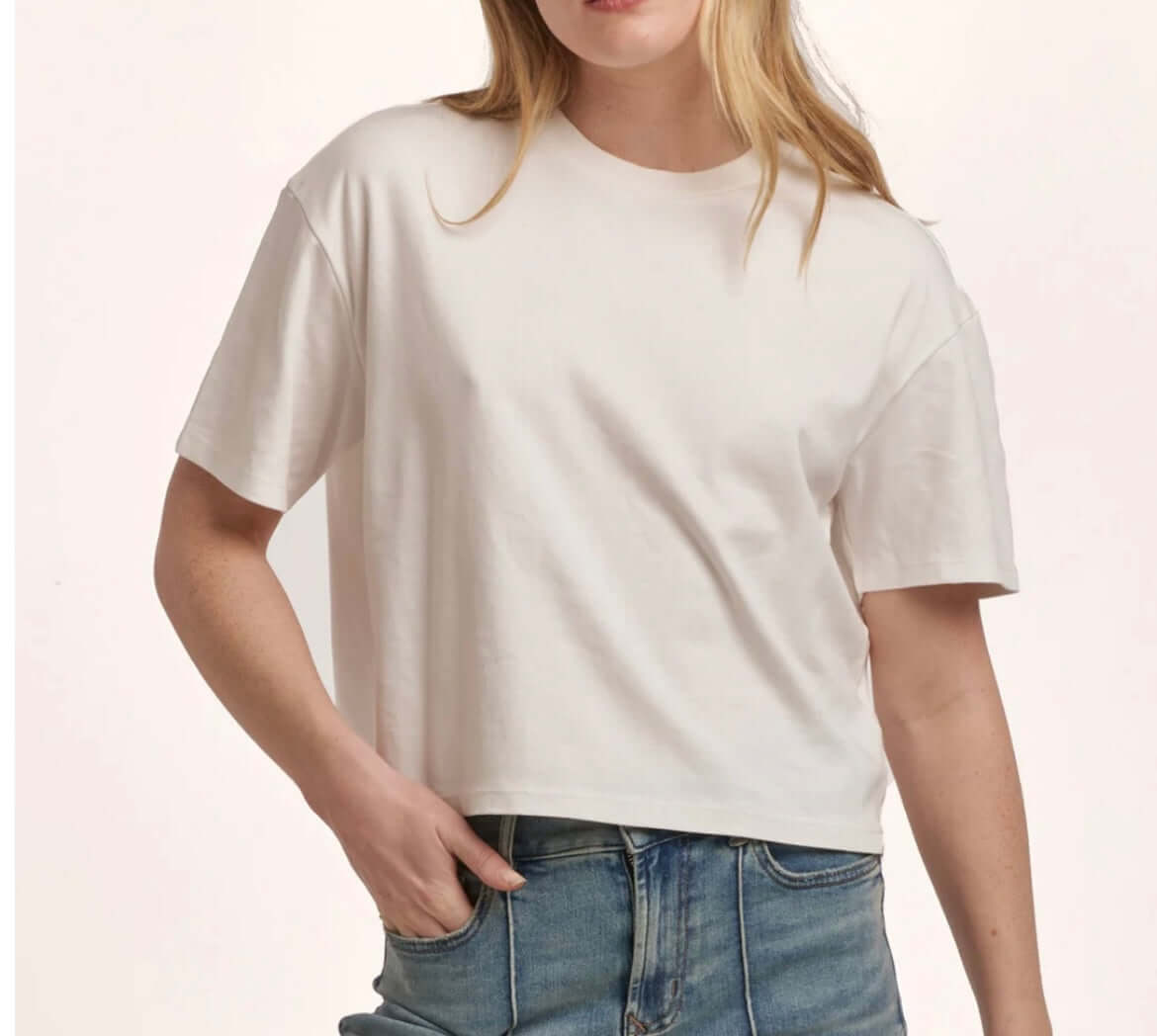 Model wearing a white Dear John Maddox Boyfriend Jersey Top, showcasing a relaxed fit and classic crew neck style.