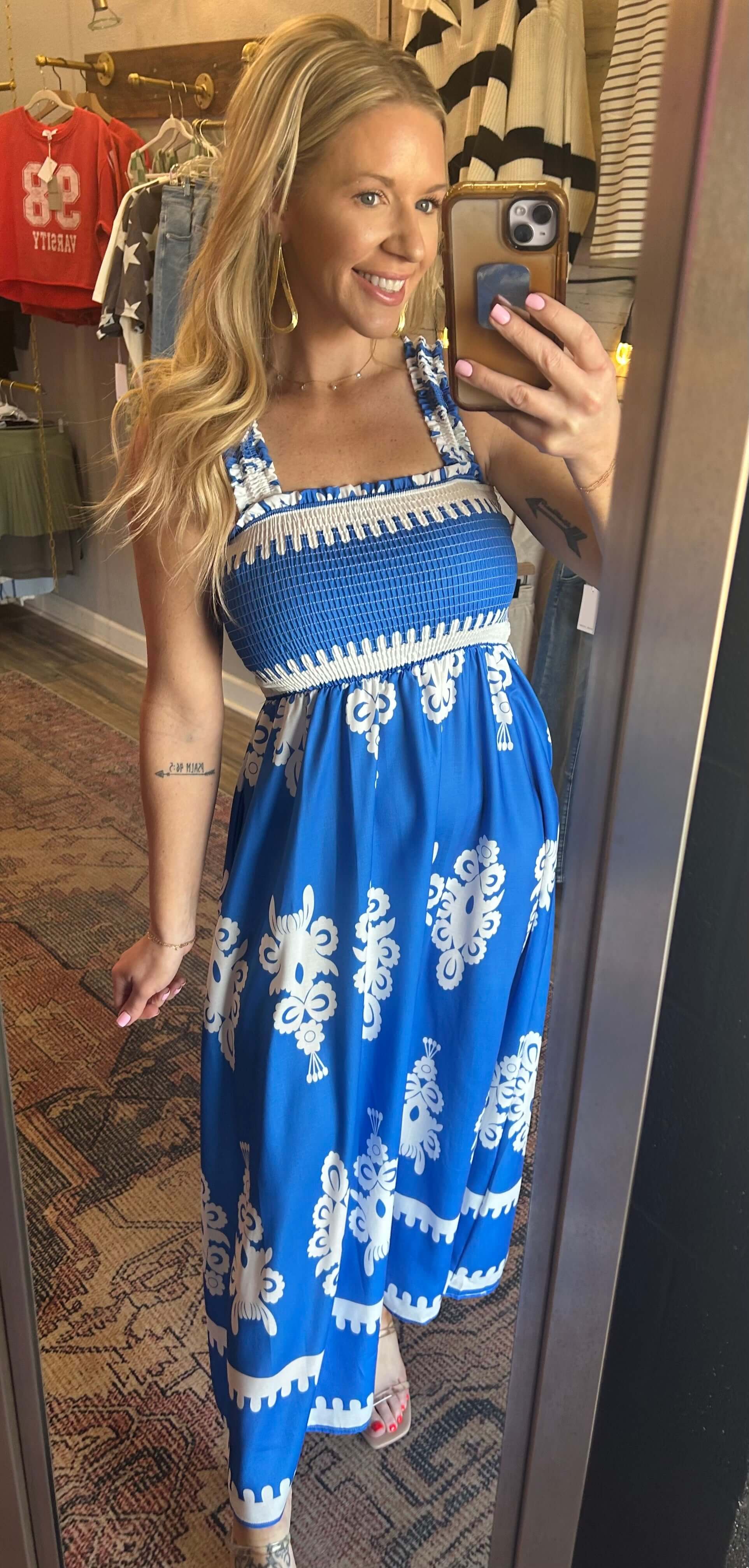 Women wearing the Bree Smocked Printed Maxi Dress in blue featuring a smocked upper and stylish design, perfect for summer occasions.