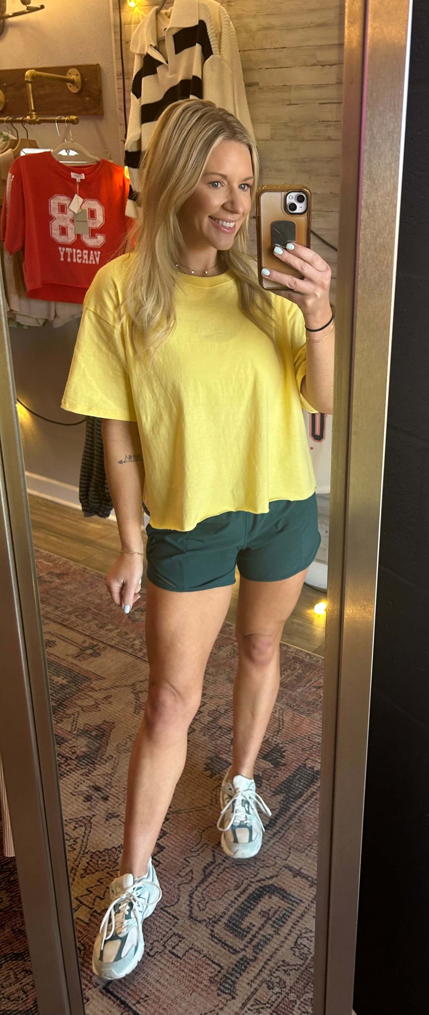 Sunshine Raw Hem Tee in creamy yellow, styled with green shorts and sneakers, perfect for summer outfits.